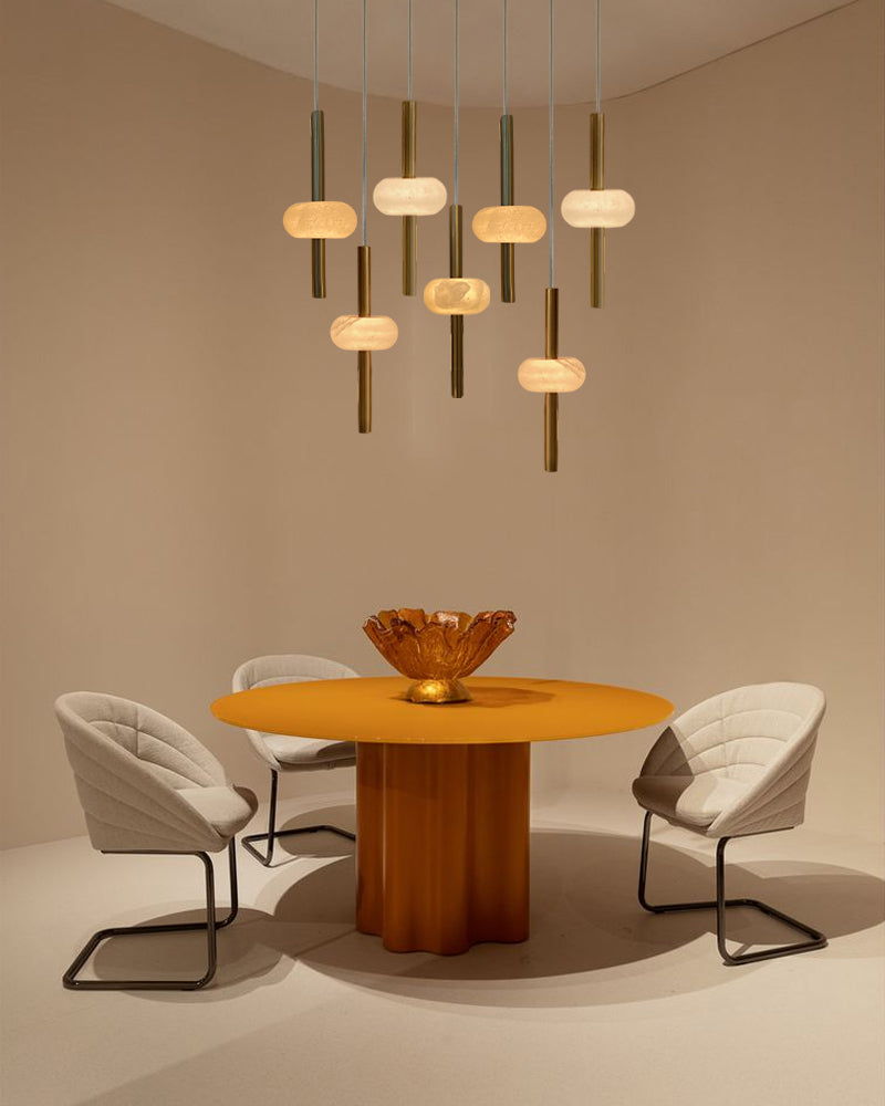 Modern dining room under pendant lights.