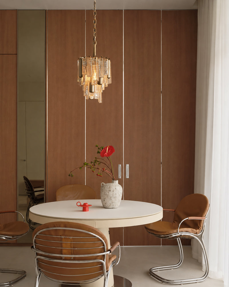 Brass crystal prism pendant light hanging chain with warm glowing glass prisms