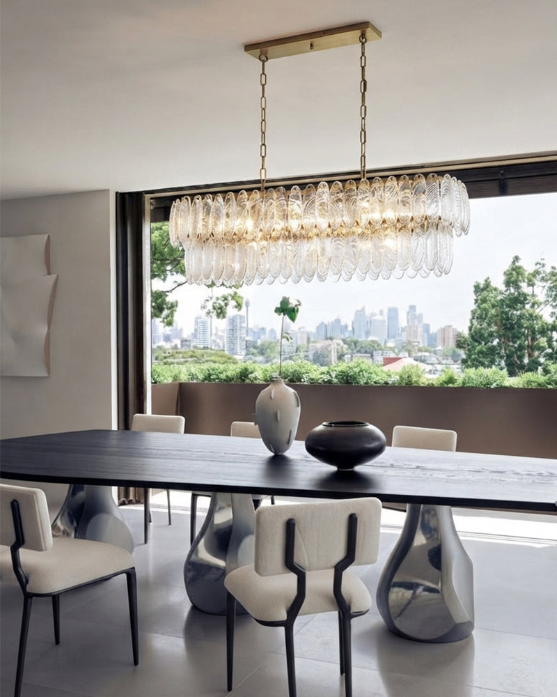 Two-tier clear glass chandelier with brass finish and long rectangular glass shades
