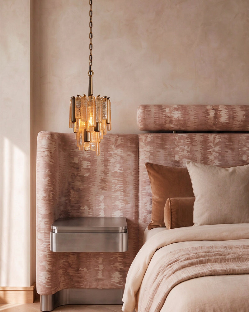 Brass multi-tier crystal prism pendant light with warm glowing glass shade cluster