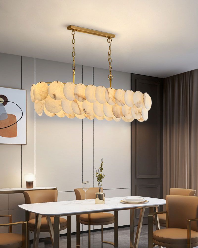 Long linear LED chandelier with Spanish marble shell above a modern dining table