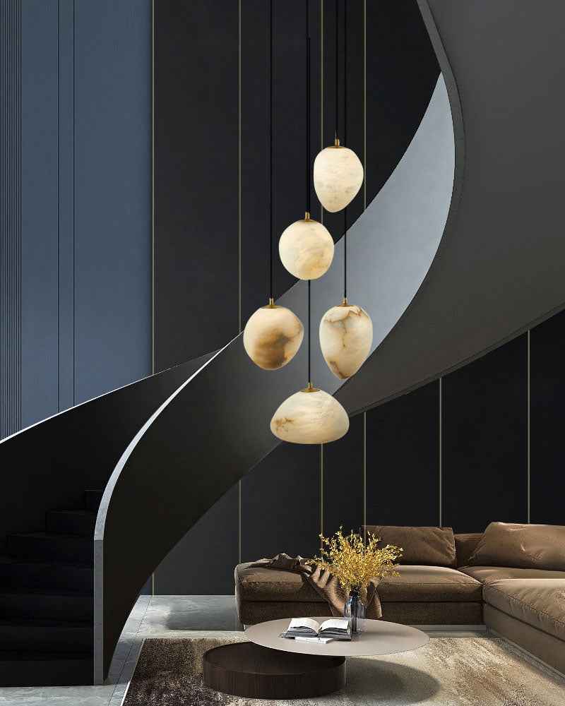 G9 Nature Alabaster Pebble pendant lights above modern staircase and seating area.