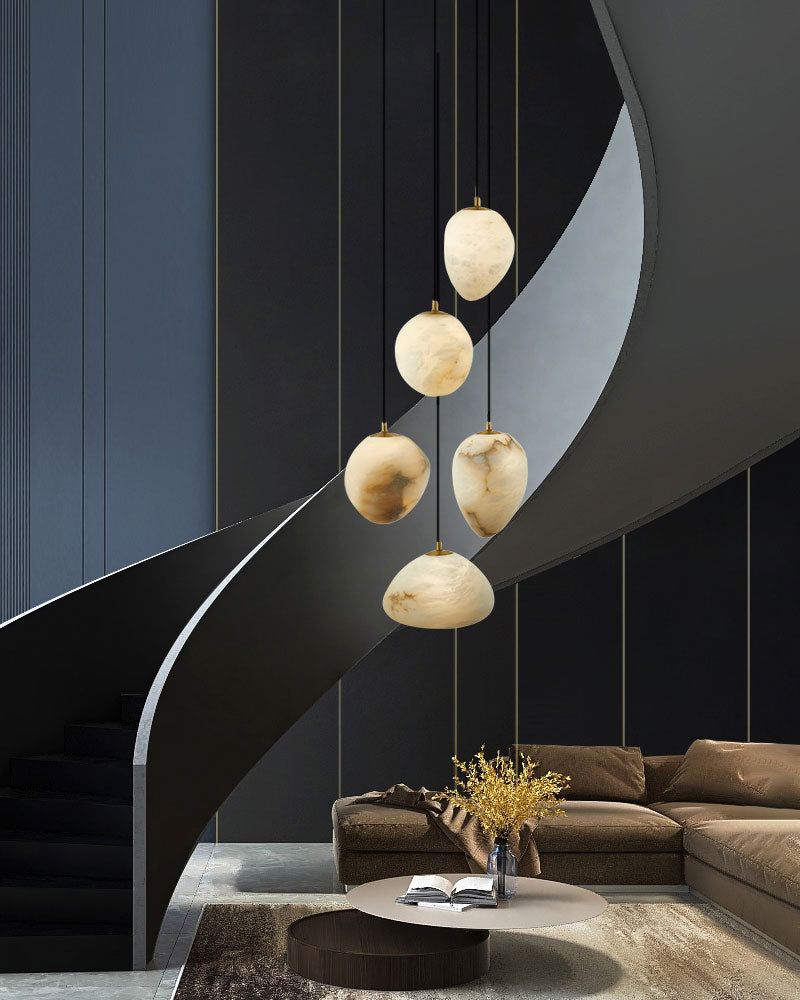 G9 Nature Alabaster Pebble pendant lights above modern staircase and seating area.
