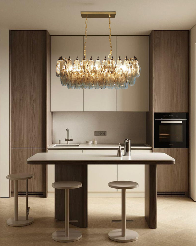 Modern kitchen with a chandelier in island