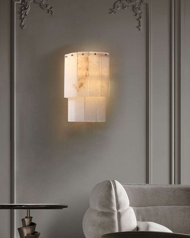 Marble 2-layer wall light fixture illuminating a chic living space.