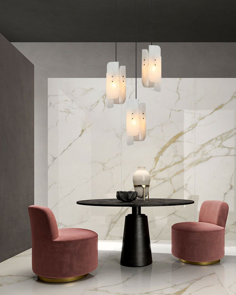 Minimalist dining area with pink chairs and alabaster pendant lamp