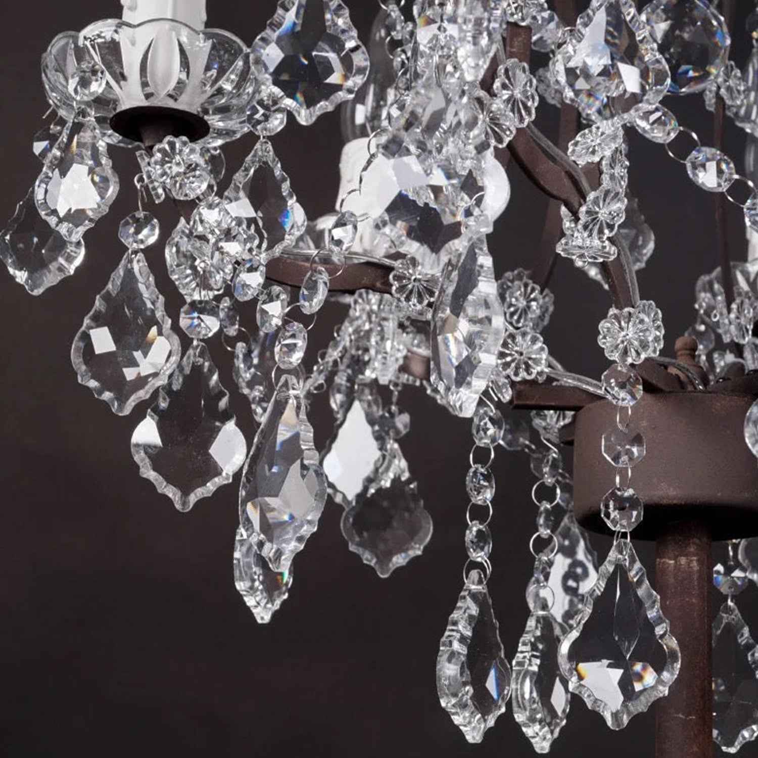 Close-up of a crystal chandelier with a dark background