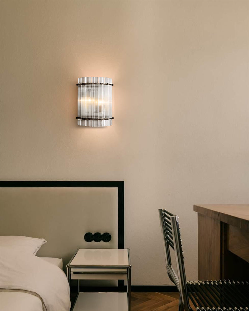 Wall-mounted light fixture in a bedroom setting