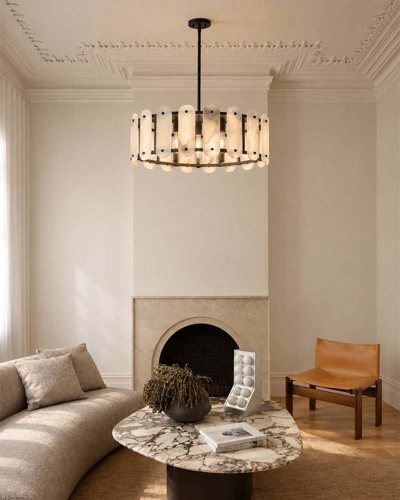 Oval alabaster pendant light with black trim and a long suspension rod