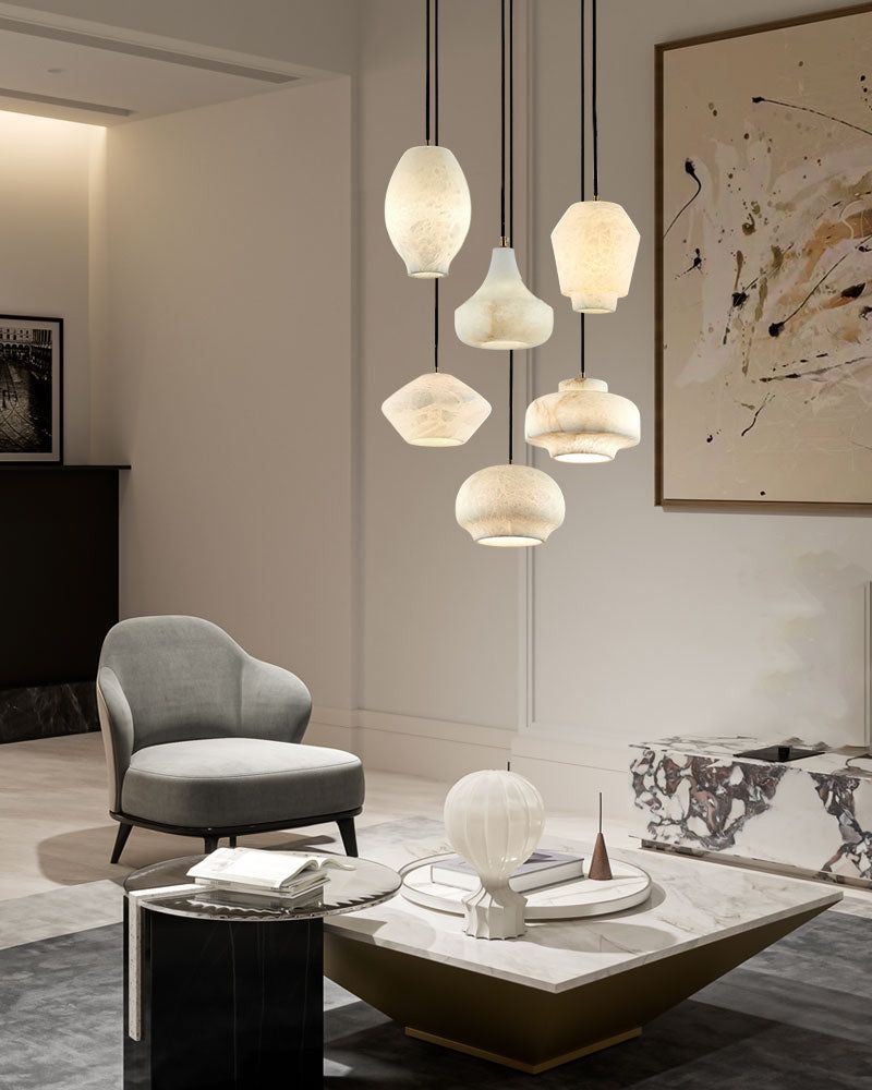 Modern living room with alabaster pendant lamps and gray armchair