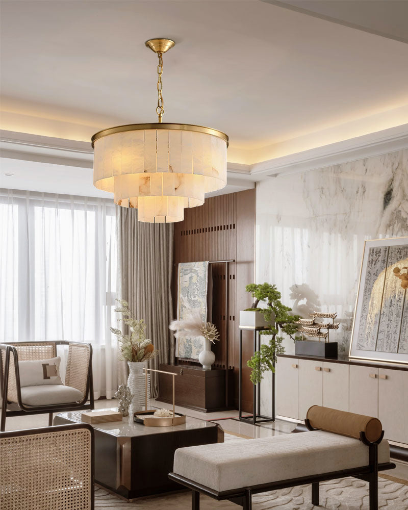 Contemporary living room featuring a brass chandelier with translucent marble shades.