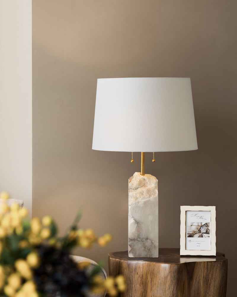 Elegant 15" white alabaster table lamp with linen shade on wooden side table