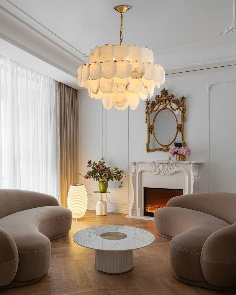 Elegant chandelier with Spanish marble shells illuminating a stylish living room setup.