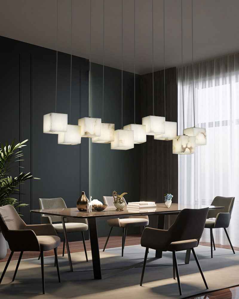 Stylish multi-cube white alabaster chandelier over modern dining table in elegant dining area.