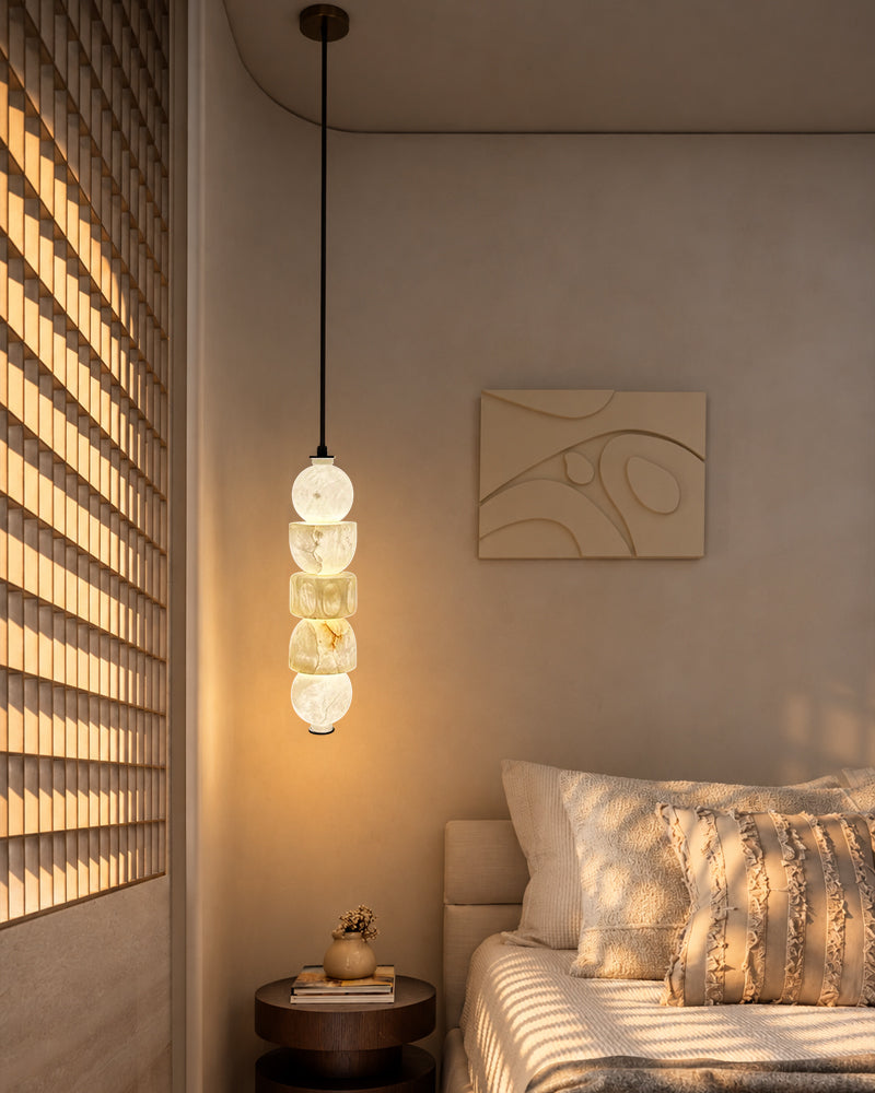 Wall-lit globe pendant light with stacked alabaster-style glass shades and black cord