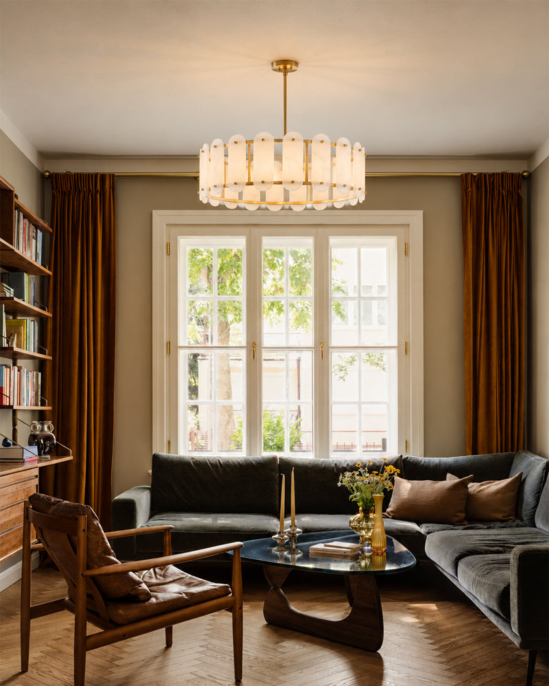Brass oval alabaster pendant light with a circular lower frame