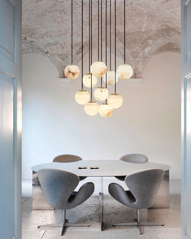 Elegant 22-light marble pendant lamp above minimalist dining table and chairs