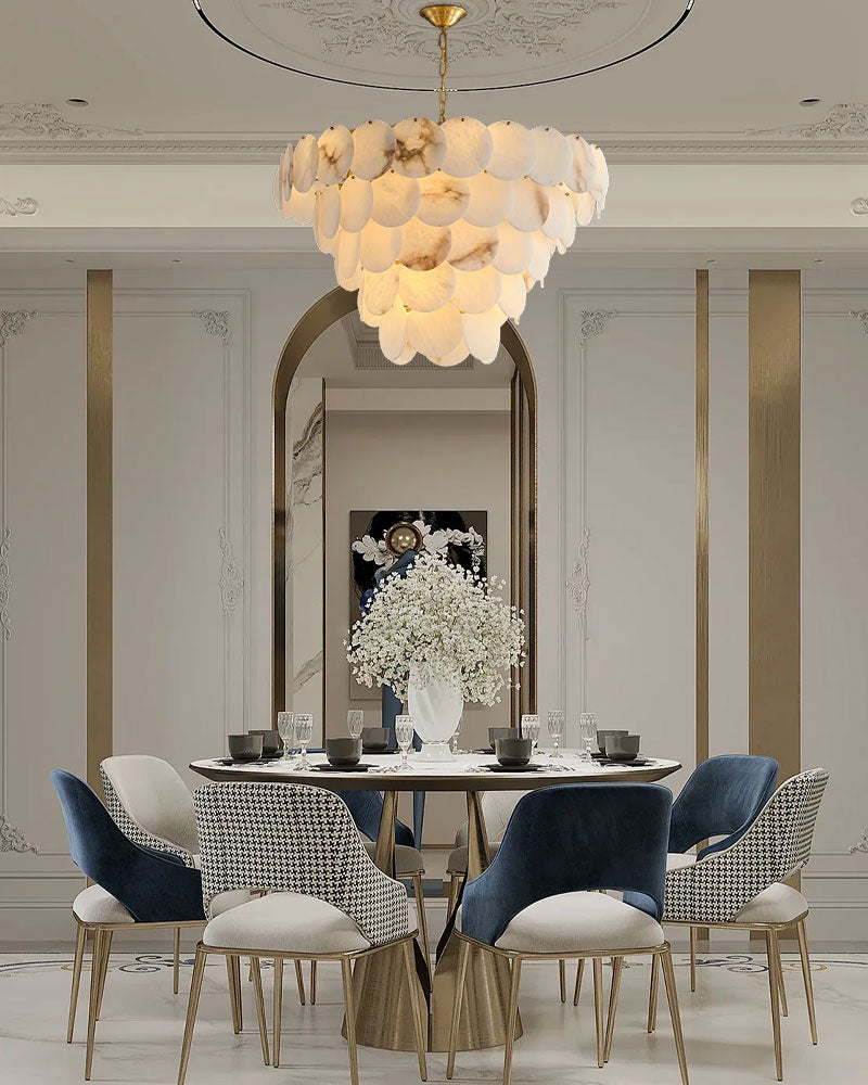 Elegant long linear chandelier with Spanish marble shell over a stylish dining table.