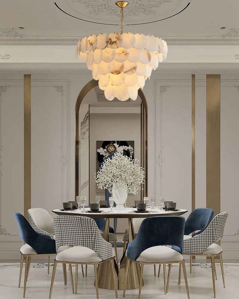 Elegant long linear chandelier with Spanish marble shell over a stylish dining table.