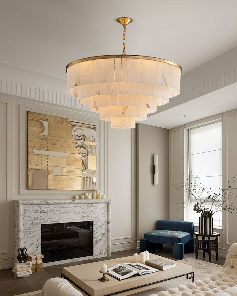Brass chandelier with translucent marble shades in a stylish living room.