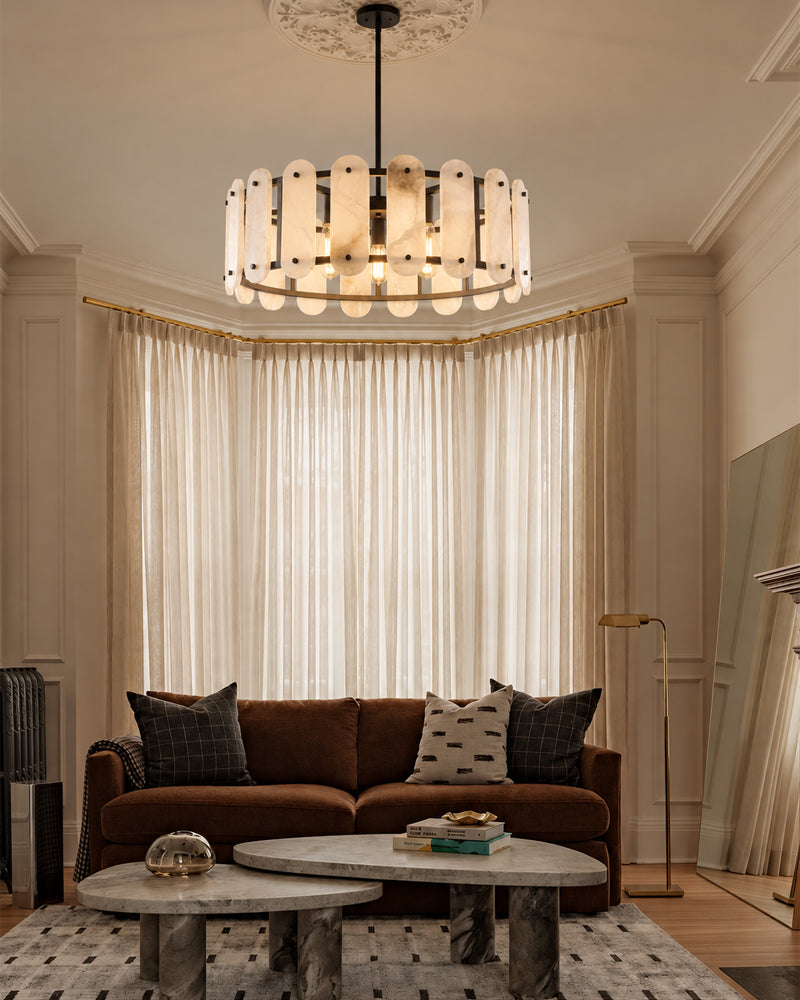 Black-trimmed oval alabaster pendant light with a circular frame