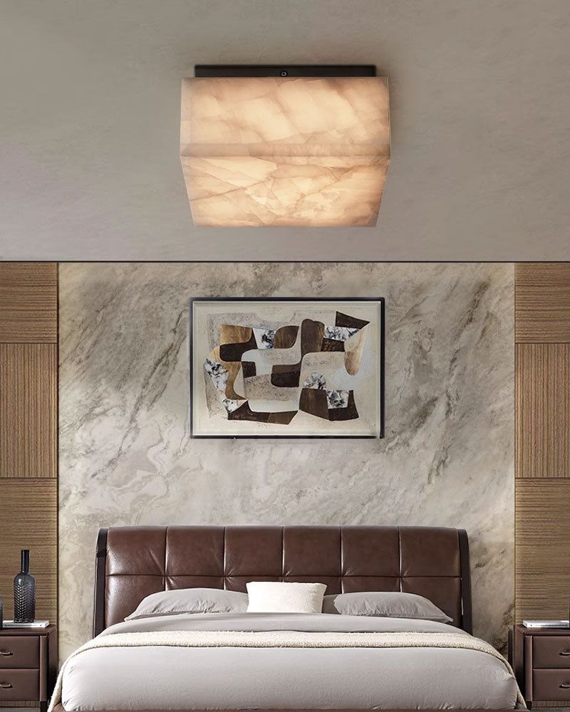 Unique alabaster ceiling light over contemporary bedroom with warm tones.