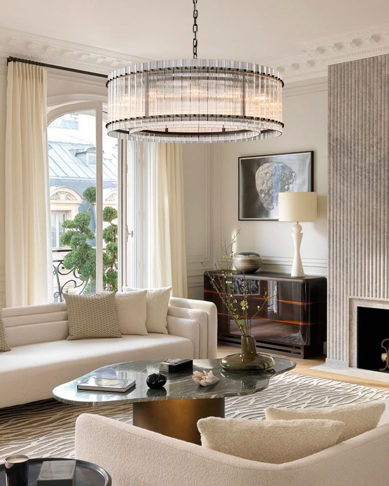 A soft White Gold finish heightens the light airy look of the collection, while Clear Glass cylinders surround the stately silhouettes of candelabra bulbs.