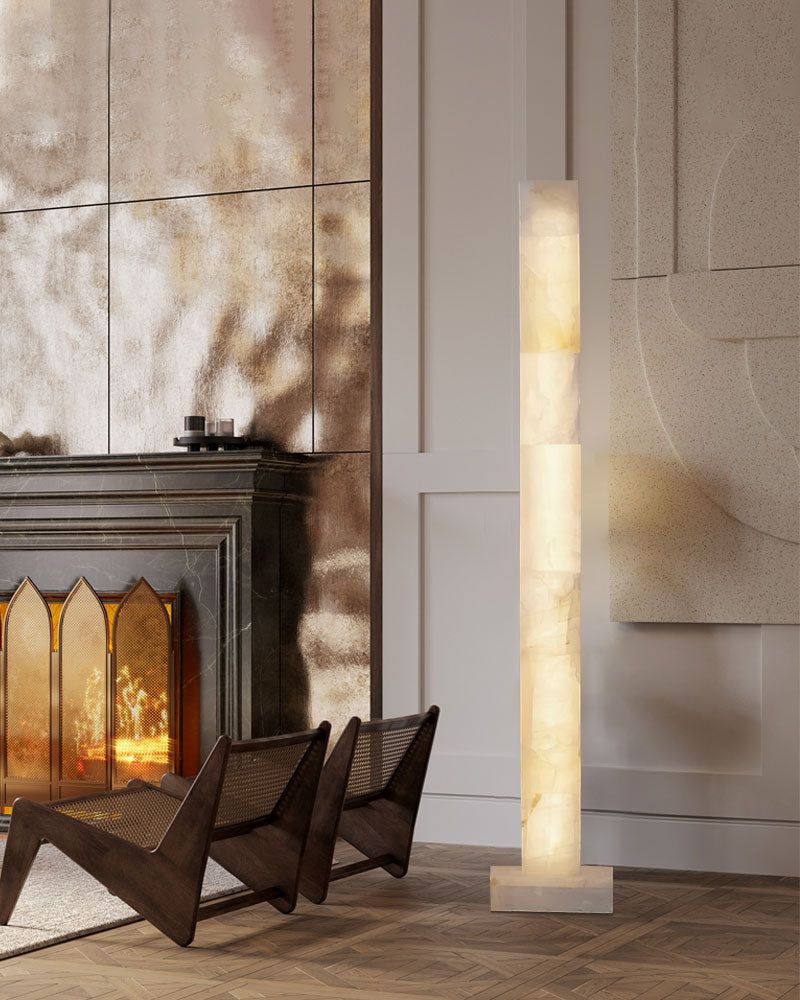 Alabaster square column floor lamp in modern living room with fireplace warm light