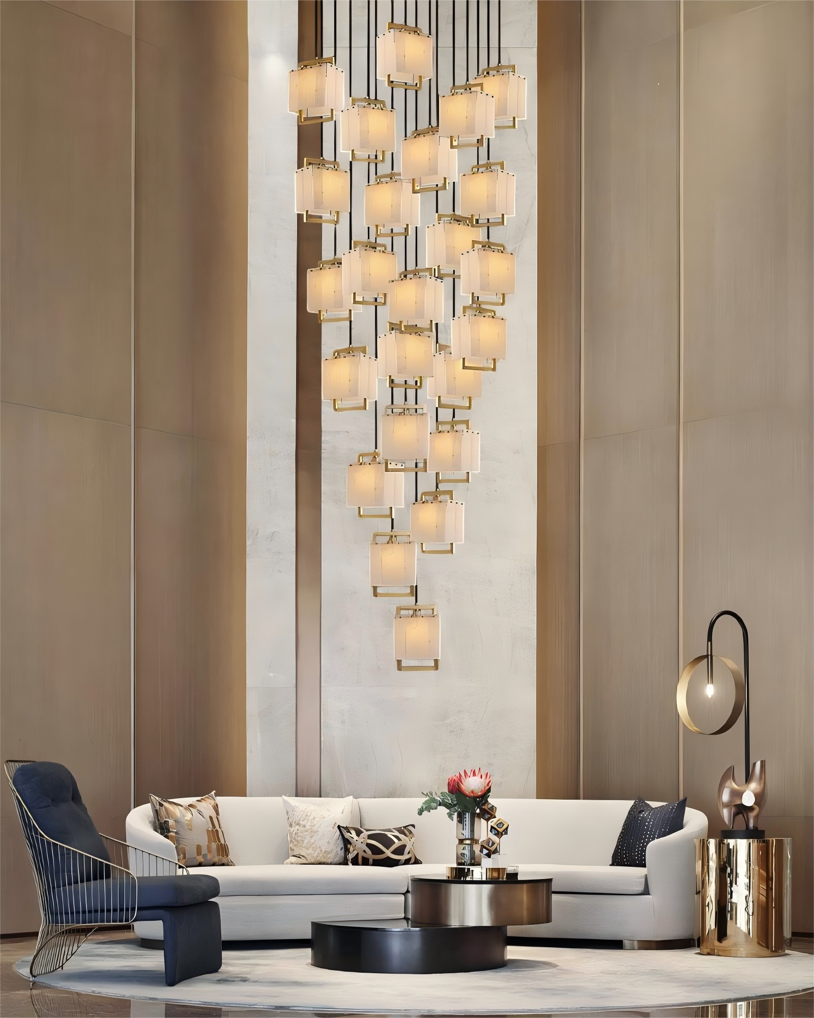 Cluster of rubbed brass and alabaster pendant lights above a luxurious modern living room