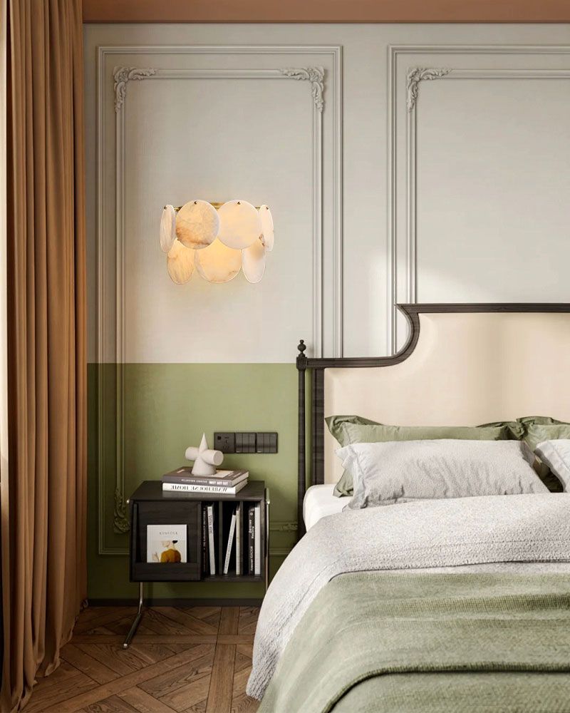 Luxurious bedroom featuring Spanish Alabaster Shell flush mount wall sconce in brass
