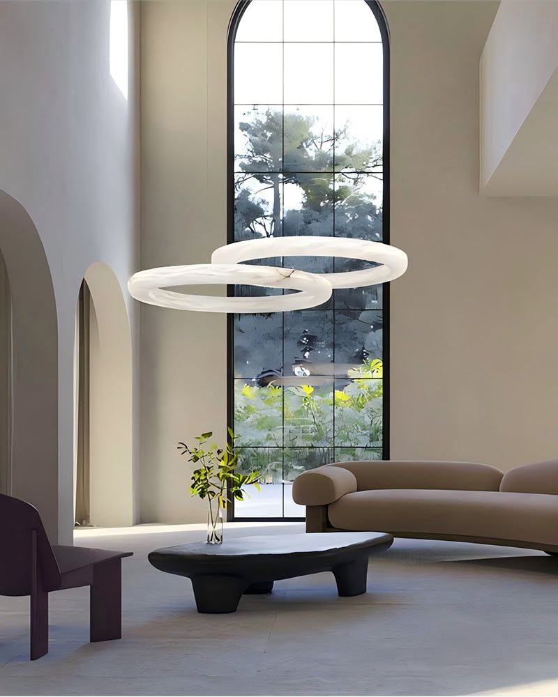 Modern living room with elegant pendant light and minimalist seating arrangement