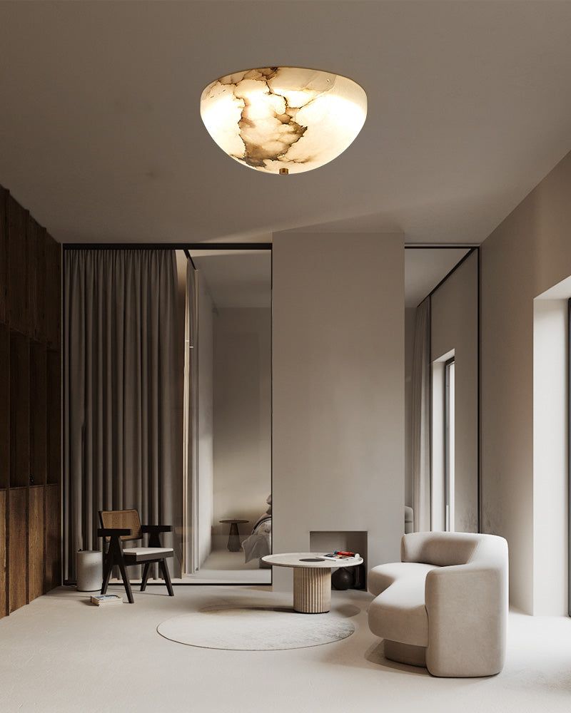 Modern living room with round alabaster ceiling light and minimalist furniture