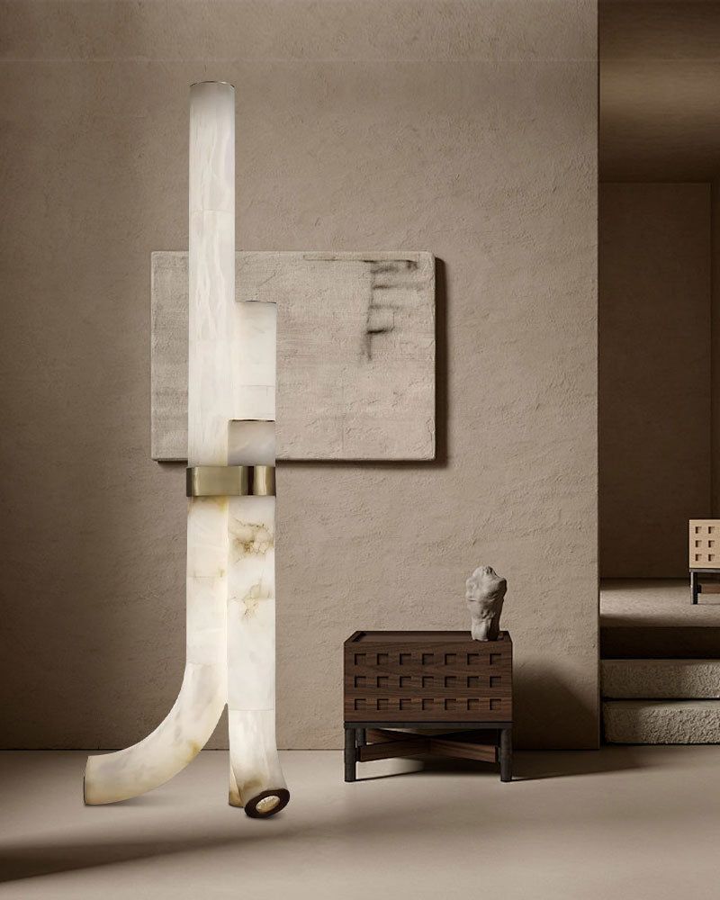 Sleek alabaster floor lamp with geometric design illuminating a stylish interior
