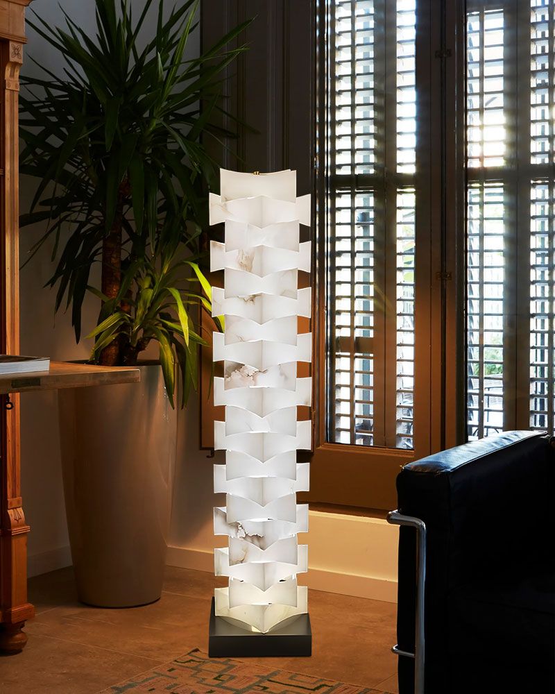Sleek high floor lamp with alabaster marble shade enhancing contemporary living space
