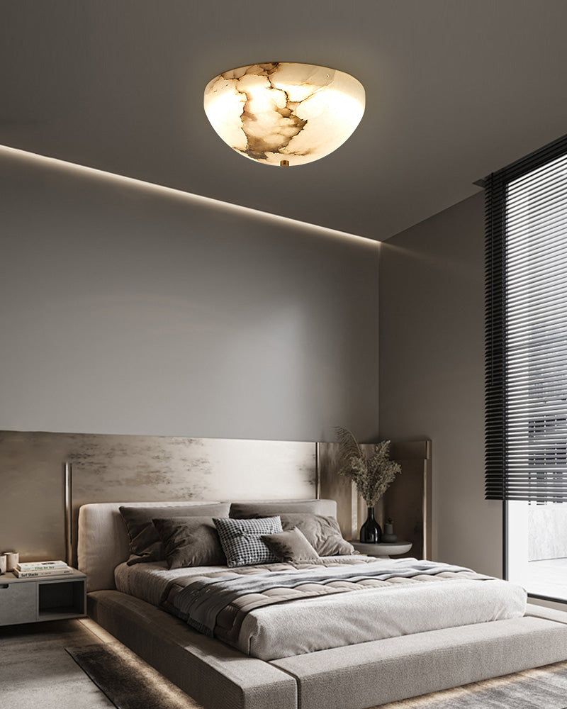 Stylish alabaster ceiling light illuminating a contemporary bedroom