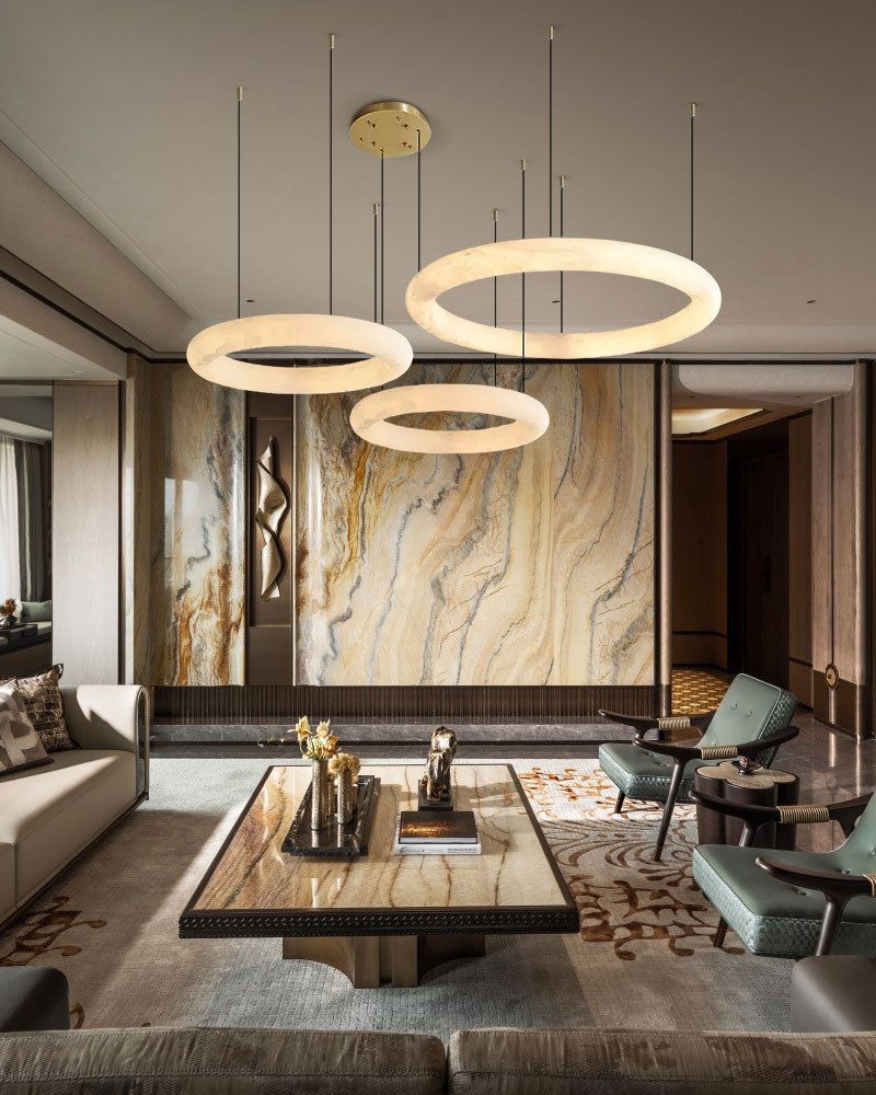 Stylish living room with circular pendant lights and marble coffee table