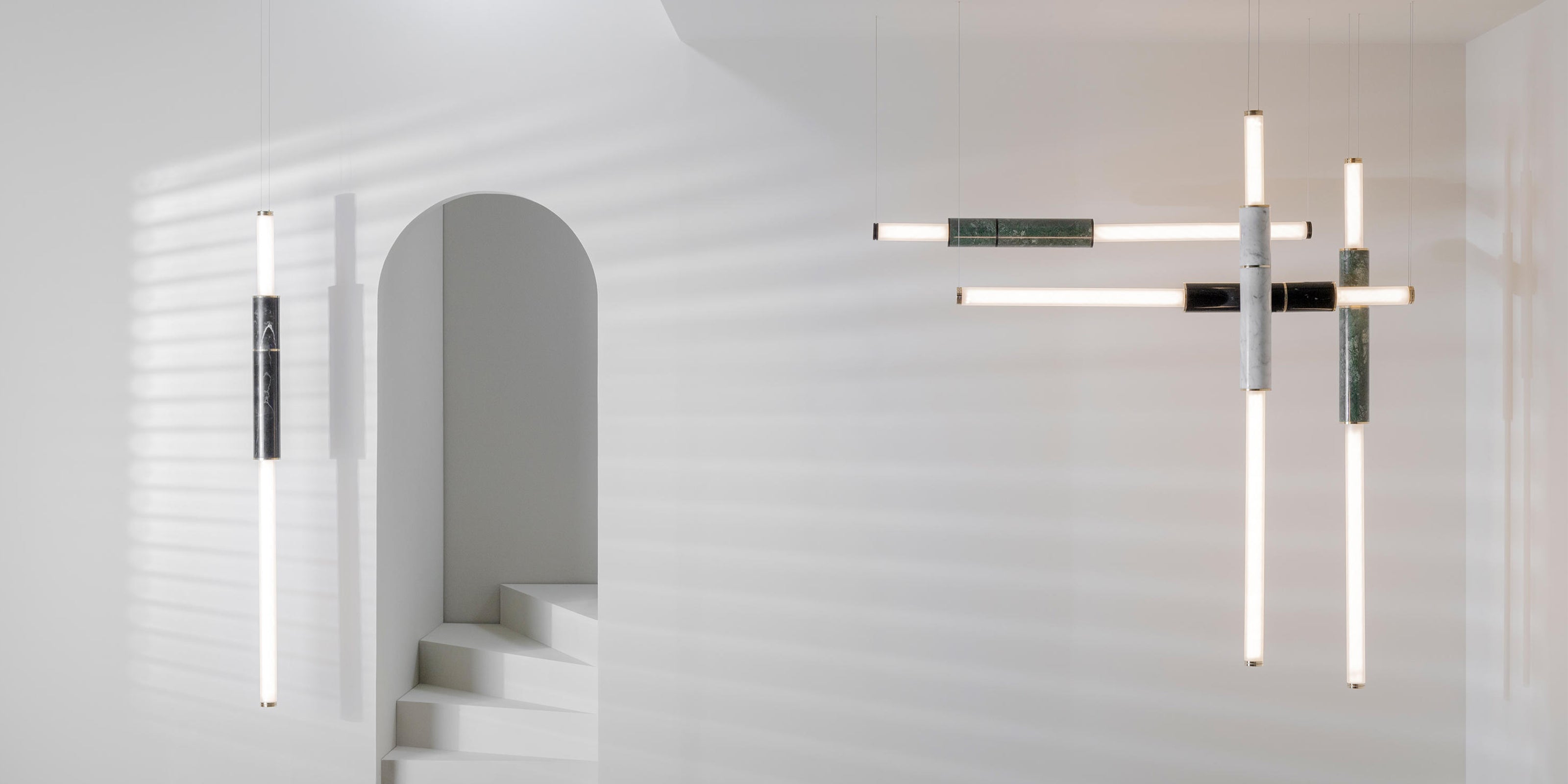 Two light pipes with polished marble segments and frosted glas