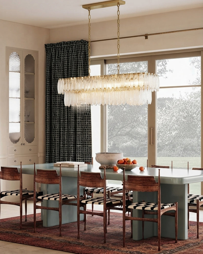 Two-tier clear glass chandelier with brass frame and chain suspension
