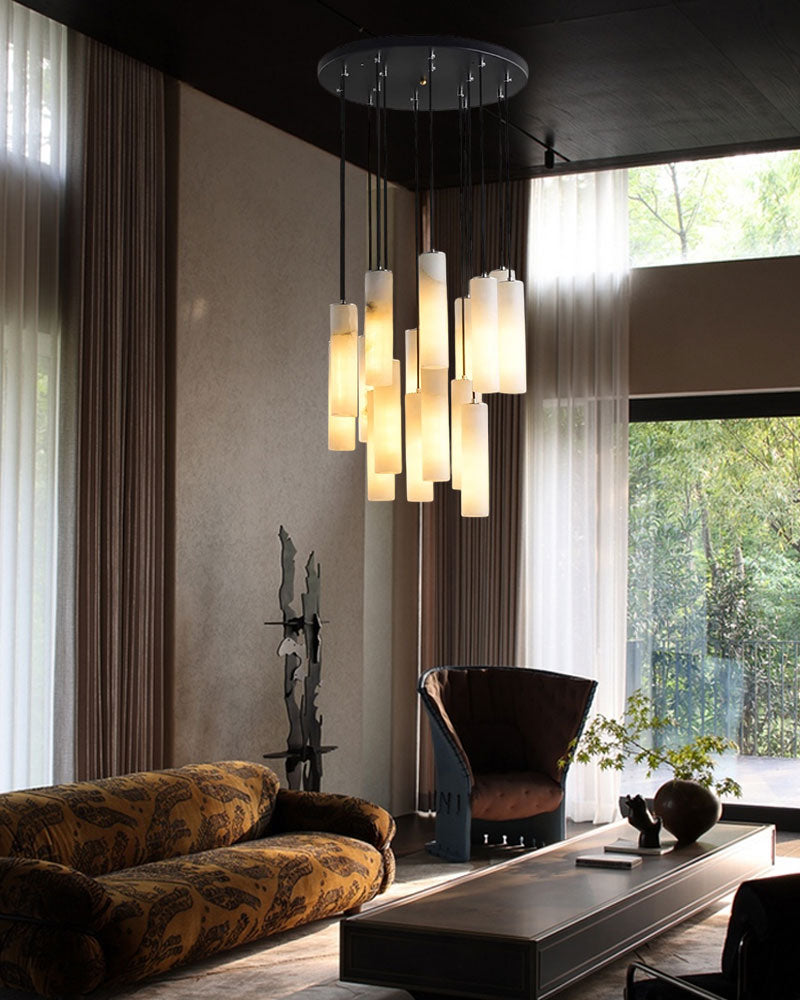 Stylish alabaster pendant lamp illuminating a modern living room with a sofa and chair.