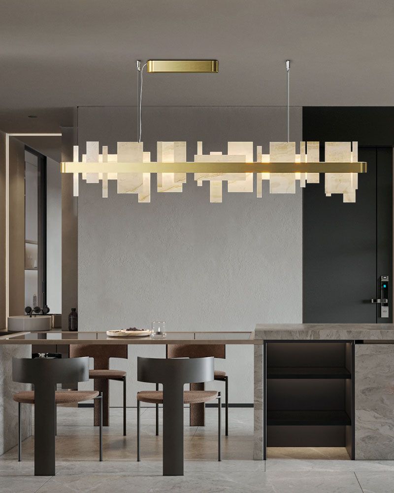 Luxury marble and metal chandelier illuminating a contemporary kitchen space