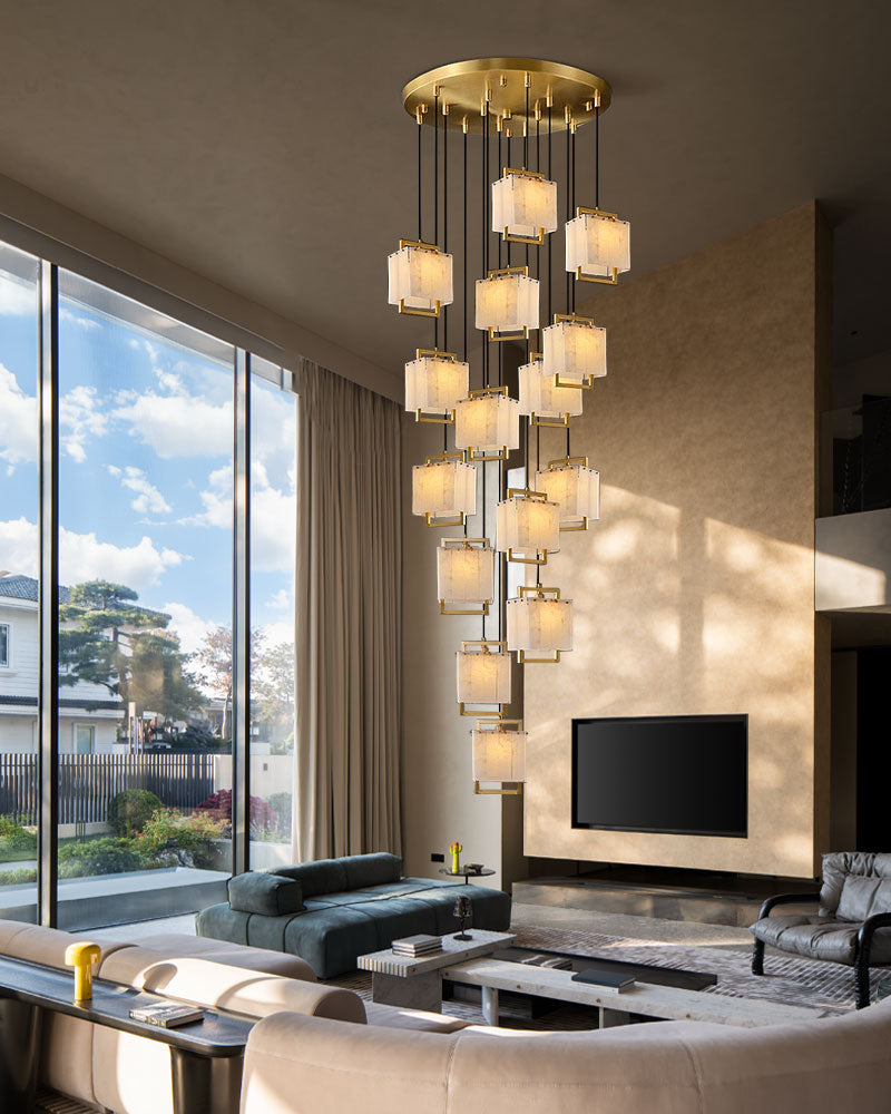 24-light cluster pendant lamp in modern living room with large windows and stylish decor.