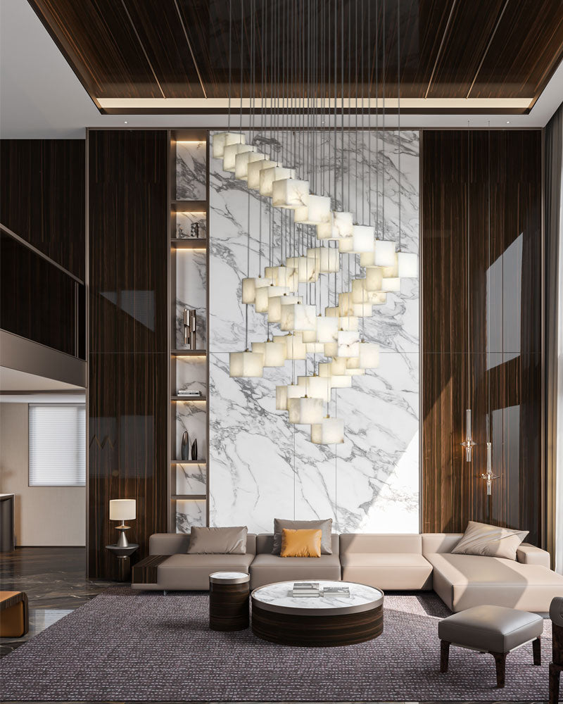 Elegant square white alabaster chandelier illuminating modern living room with marble wall.