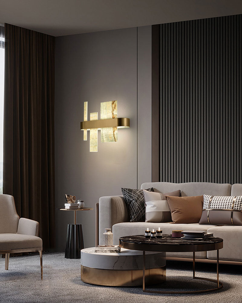 Elegant marble and metal wall lamp illuminating a modern living room setup