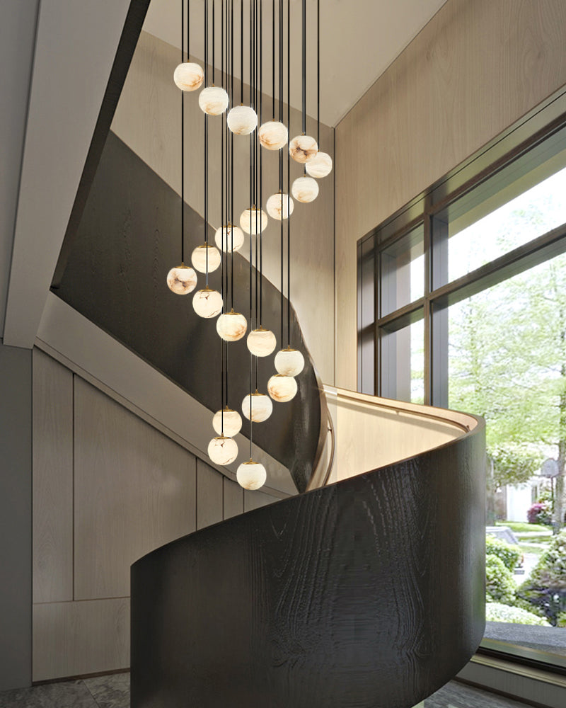 22-light marble pendant lamp cluster illuminating contemporary staircase interior