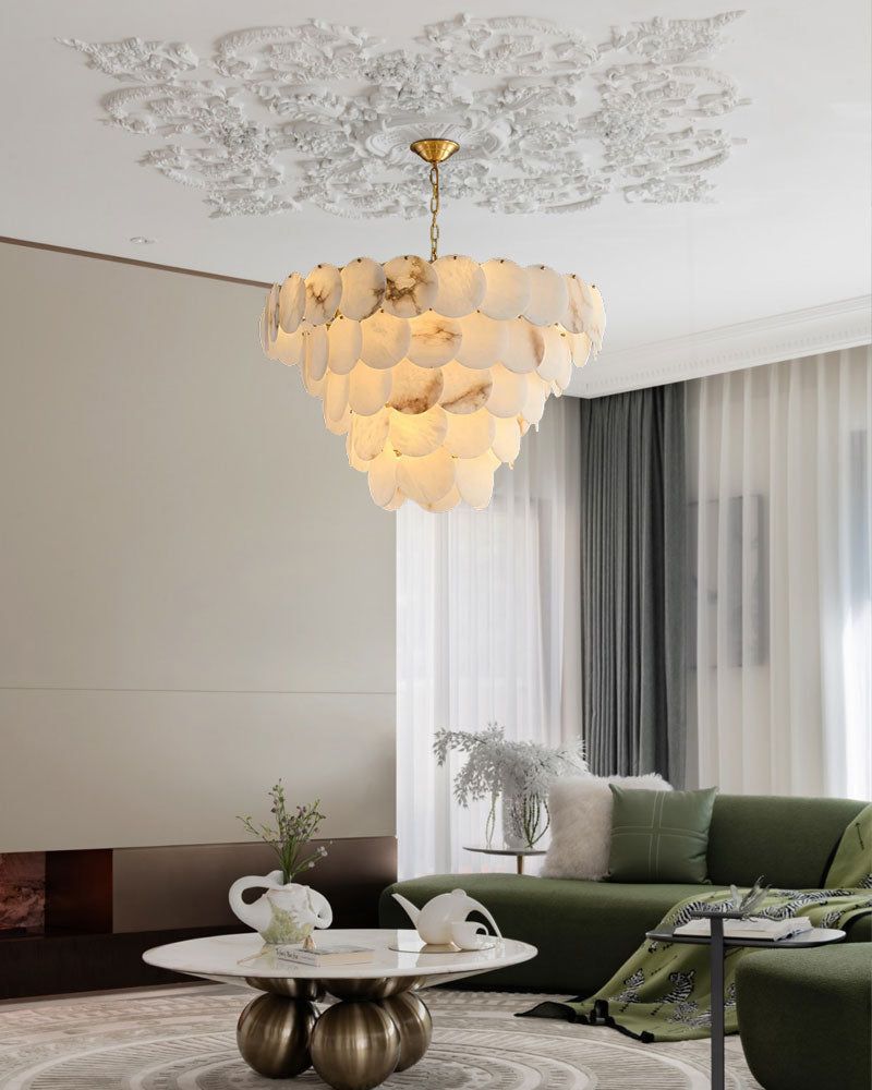Exquisite LED chandelier made of Spanish marble shell above a contemporary living room setup
