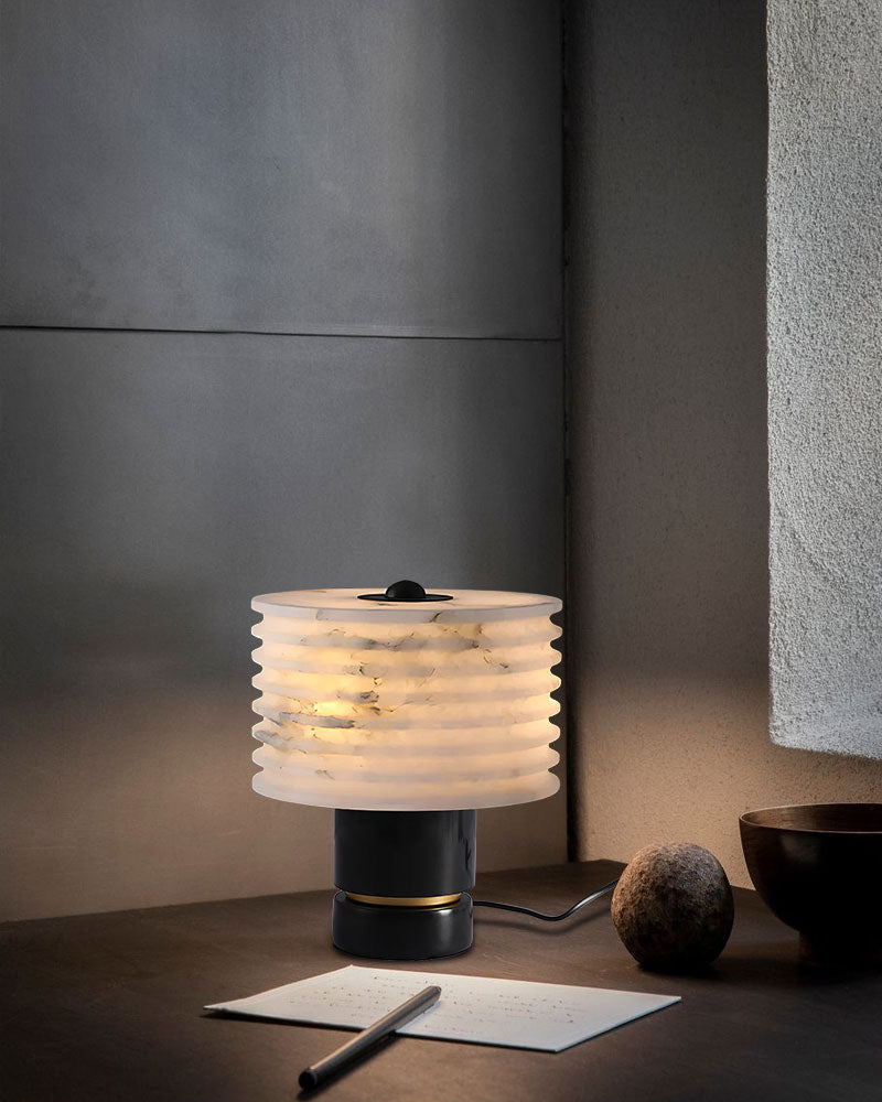 G9 Cloud marble table lamp with textured alabaster shade illuminating a stylish side table