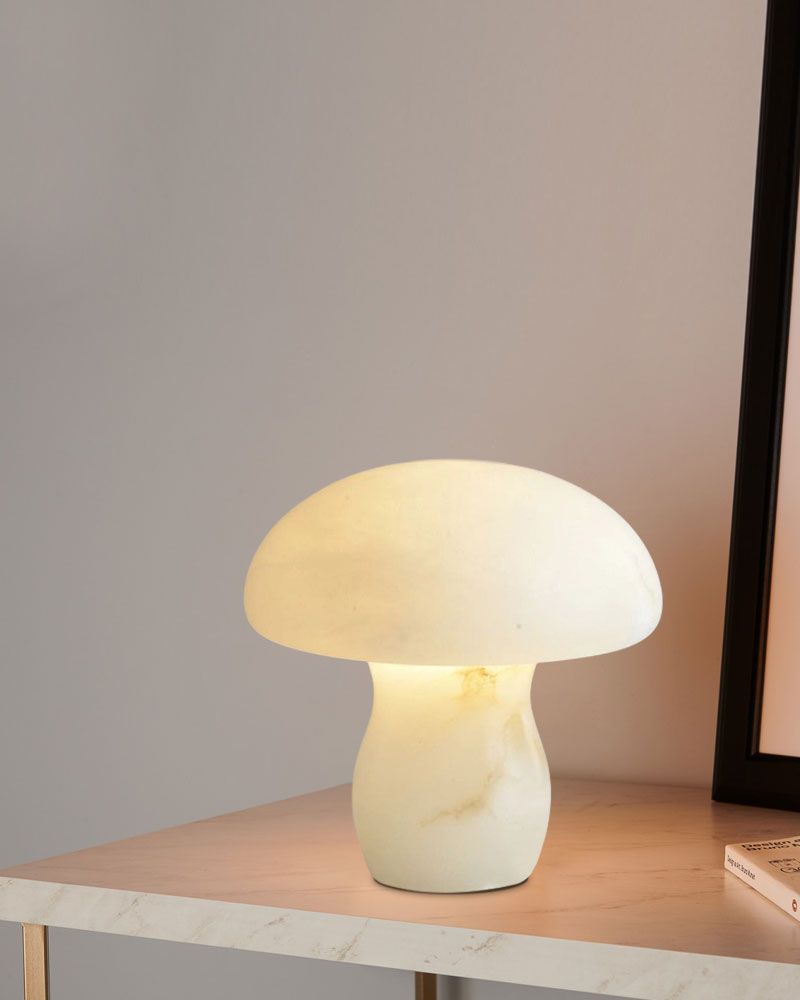 Mushroom lamp glowing softly, adding warmth to a stylishly decorated tabletop.