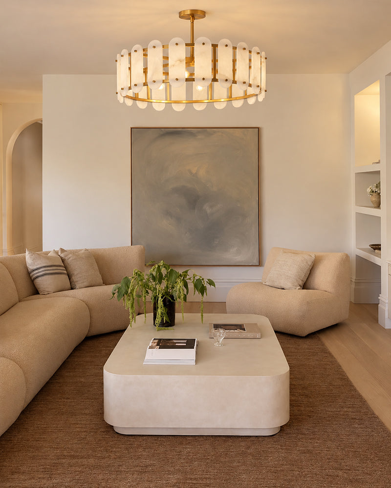 Oval alabaster pendant light with brass trim and a circular frame