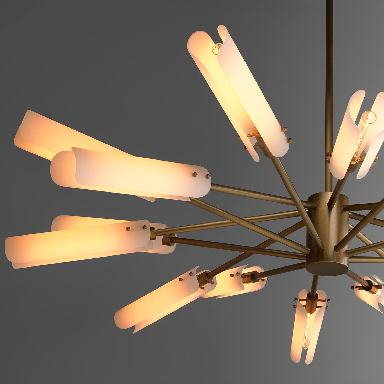 Modern chandelier with multiple light fixtures on a dark background