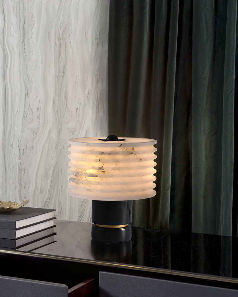 G9 Cloud marble table lamp with textured alabaster shade on black surface